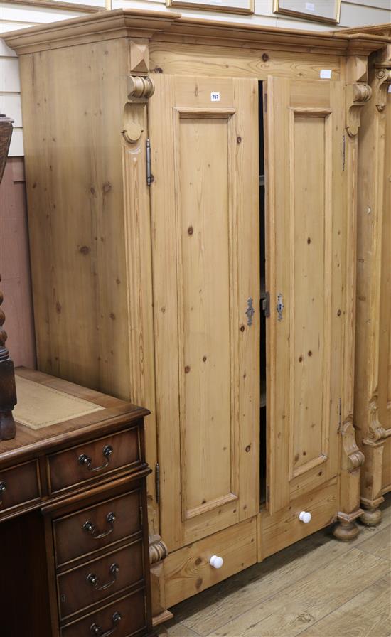 A 19th century French stripped pine two door wardrobe W.110cm